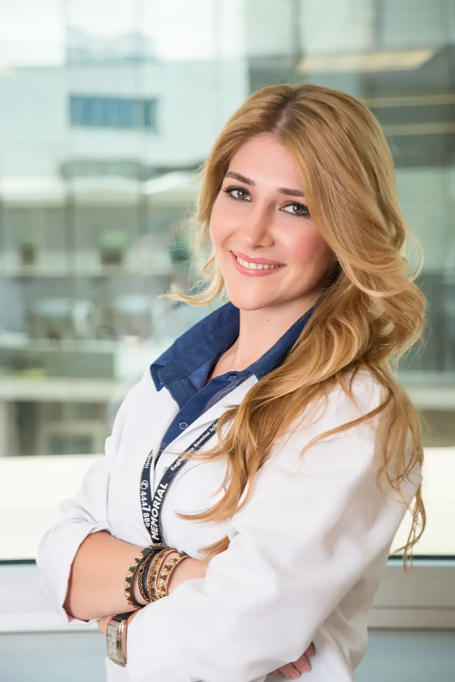 Professional in a white coat smiling for a branding portrait