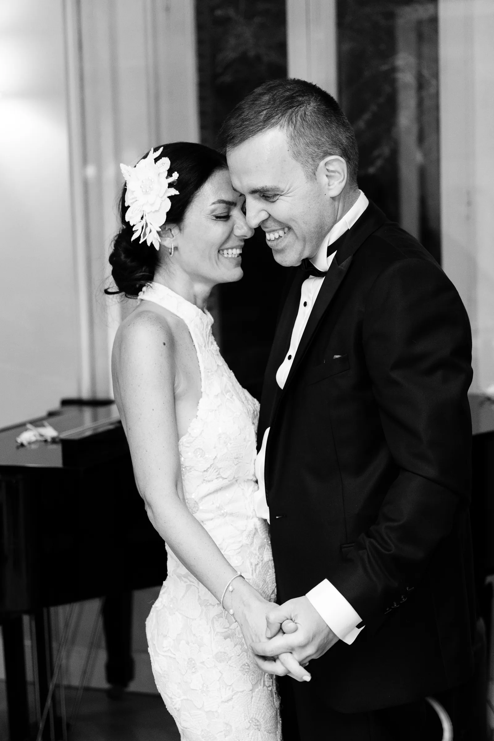 Couple dancing forehead to forehead at their first dance, black and white